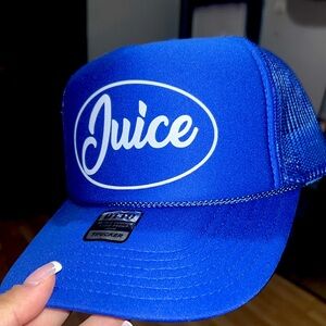 Trucker Hats in different color ways (Blue, Pink, and green)